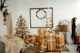 brown cardboard christmas tree with christmas presents and decorations